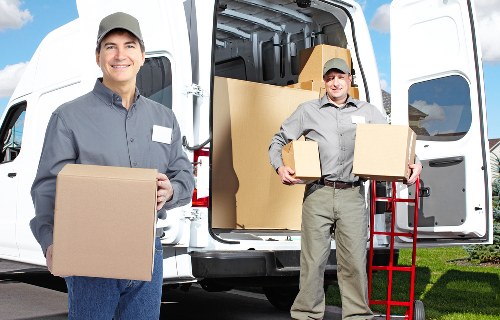 Boxes and furniture being loaded for a local same day removal service