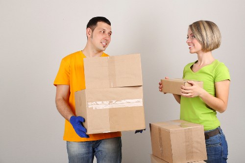 Mover wearing PPE while handling items during a van job